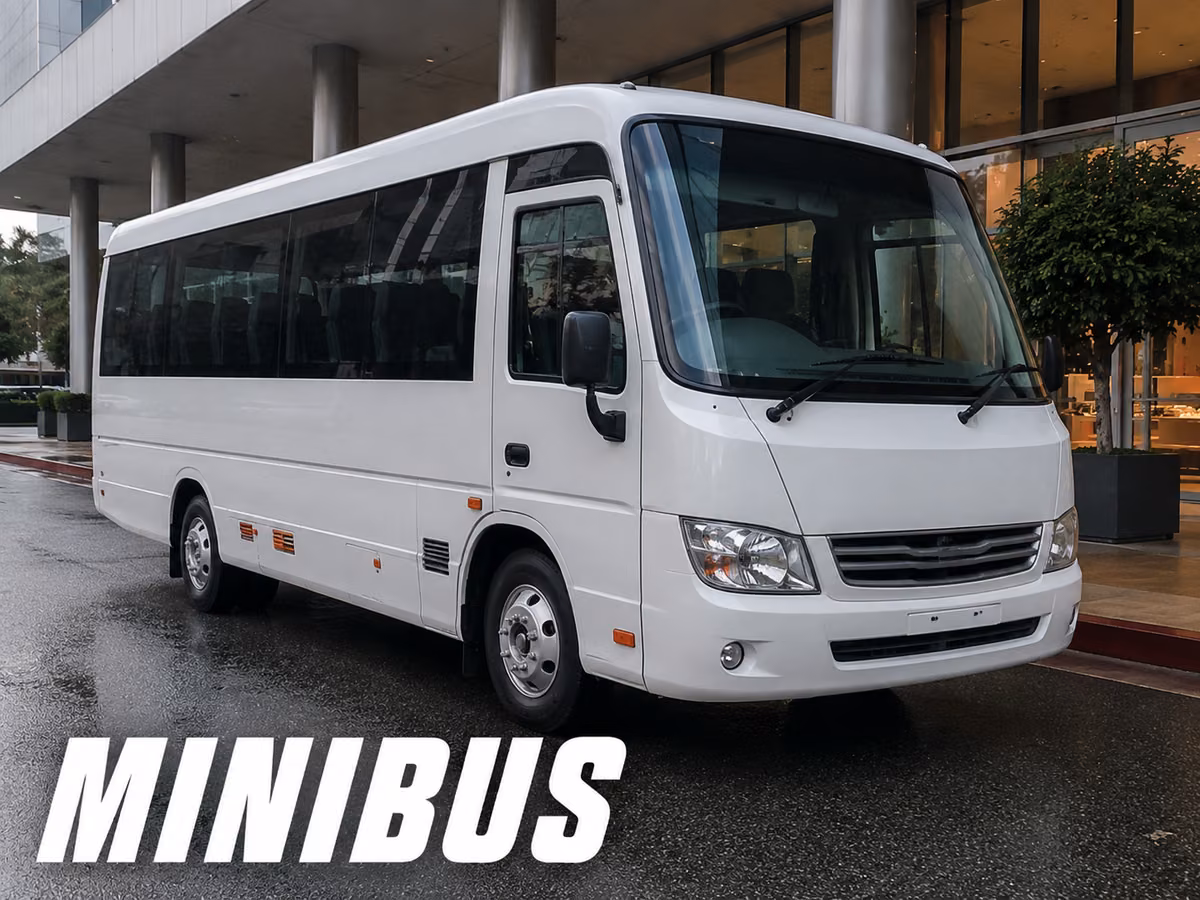 White minibus with a smooth lower body and no underfloor luggage bay doors