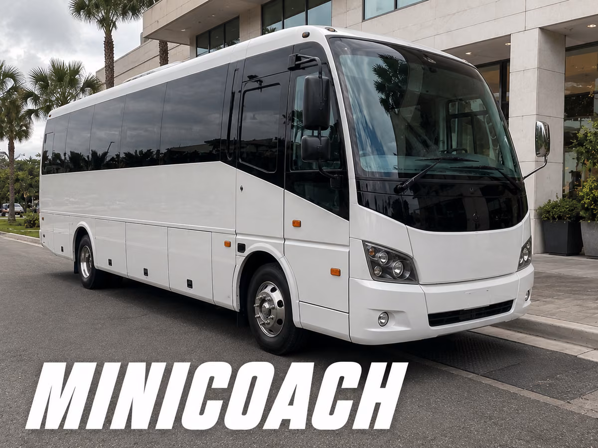 White minicoach with underfloor luggage bay doors visible along its lower body