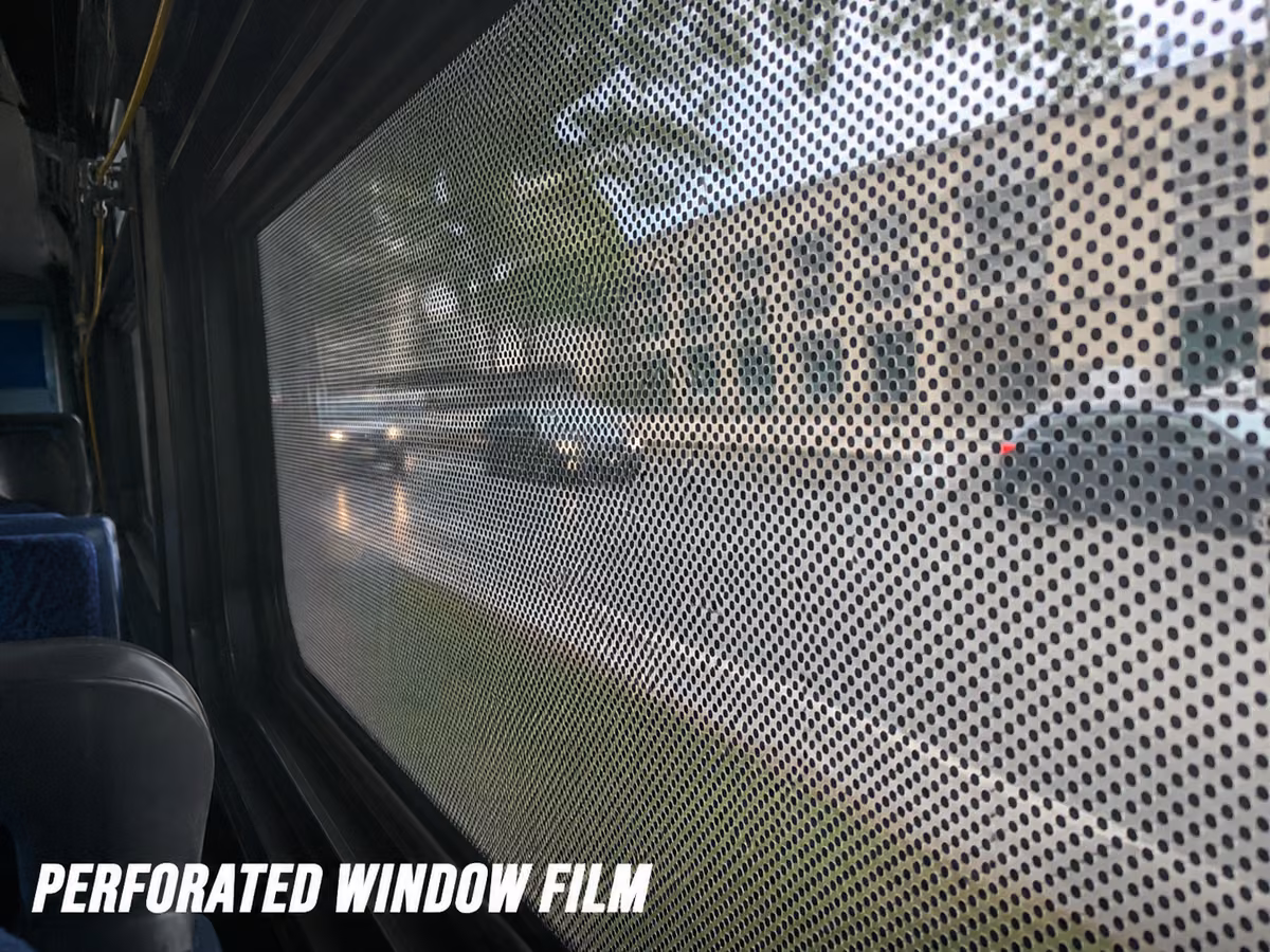 Perforated window film showing its grid of small holes
