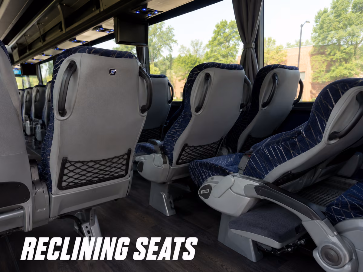 Reclining charter bus seat with the footrest extended