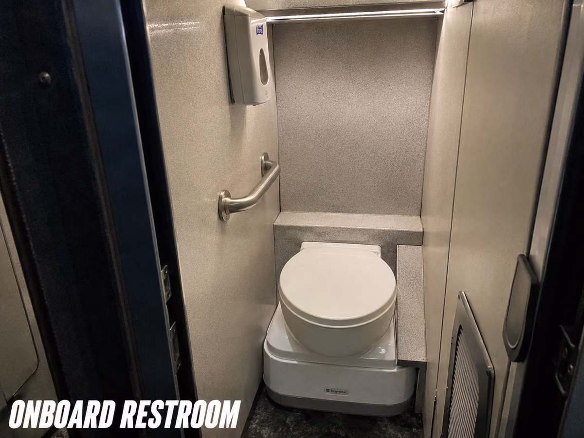 Chemical lavatory unit in the rear compartment of a charter bus