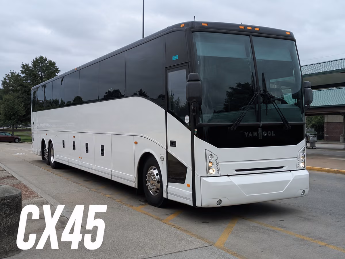 White Van Hool CX45 coach on a paved lot