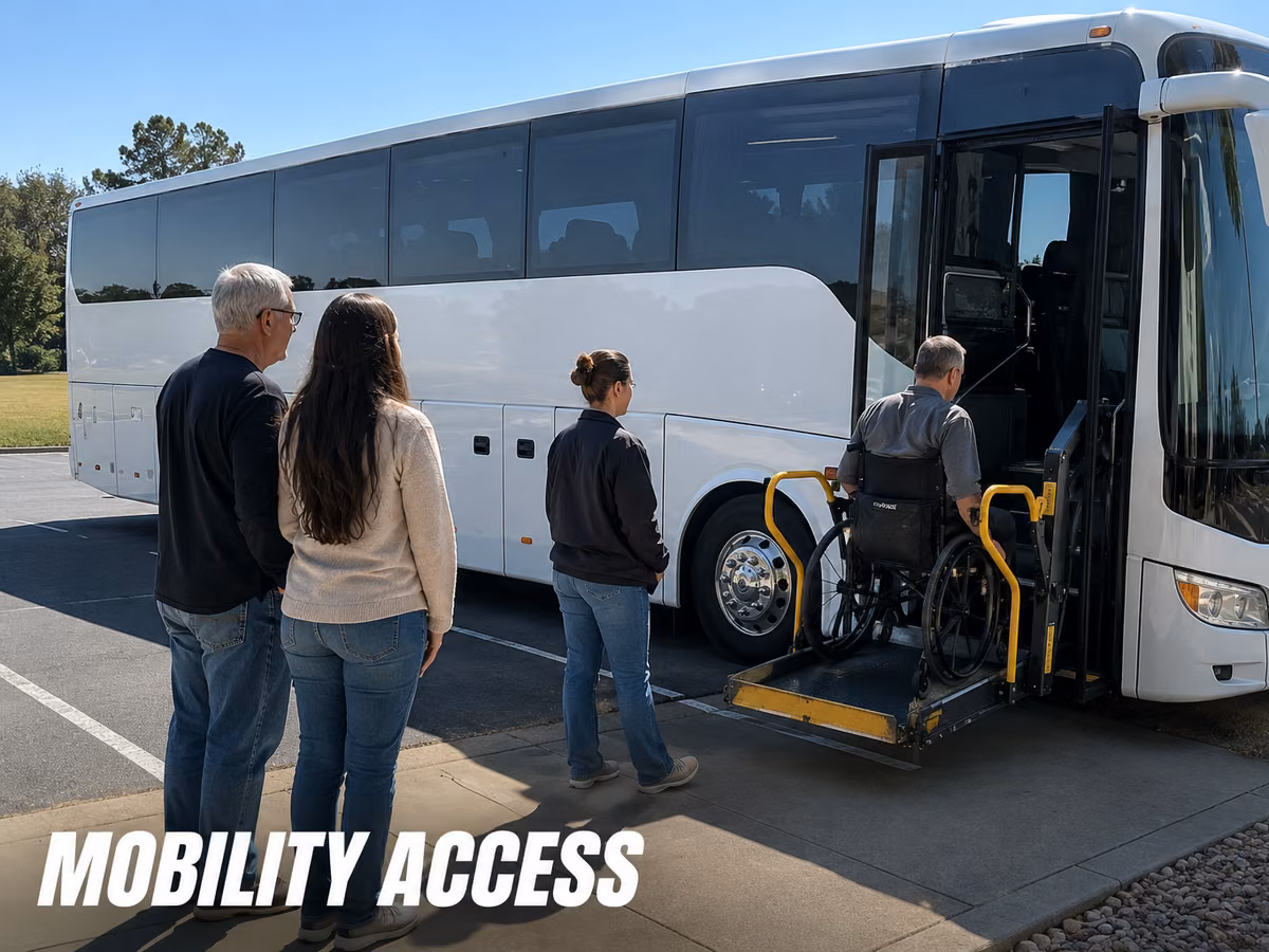 Wheelchair lift deployed at the side of a coach with passengers nearby