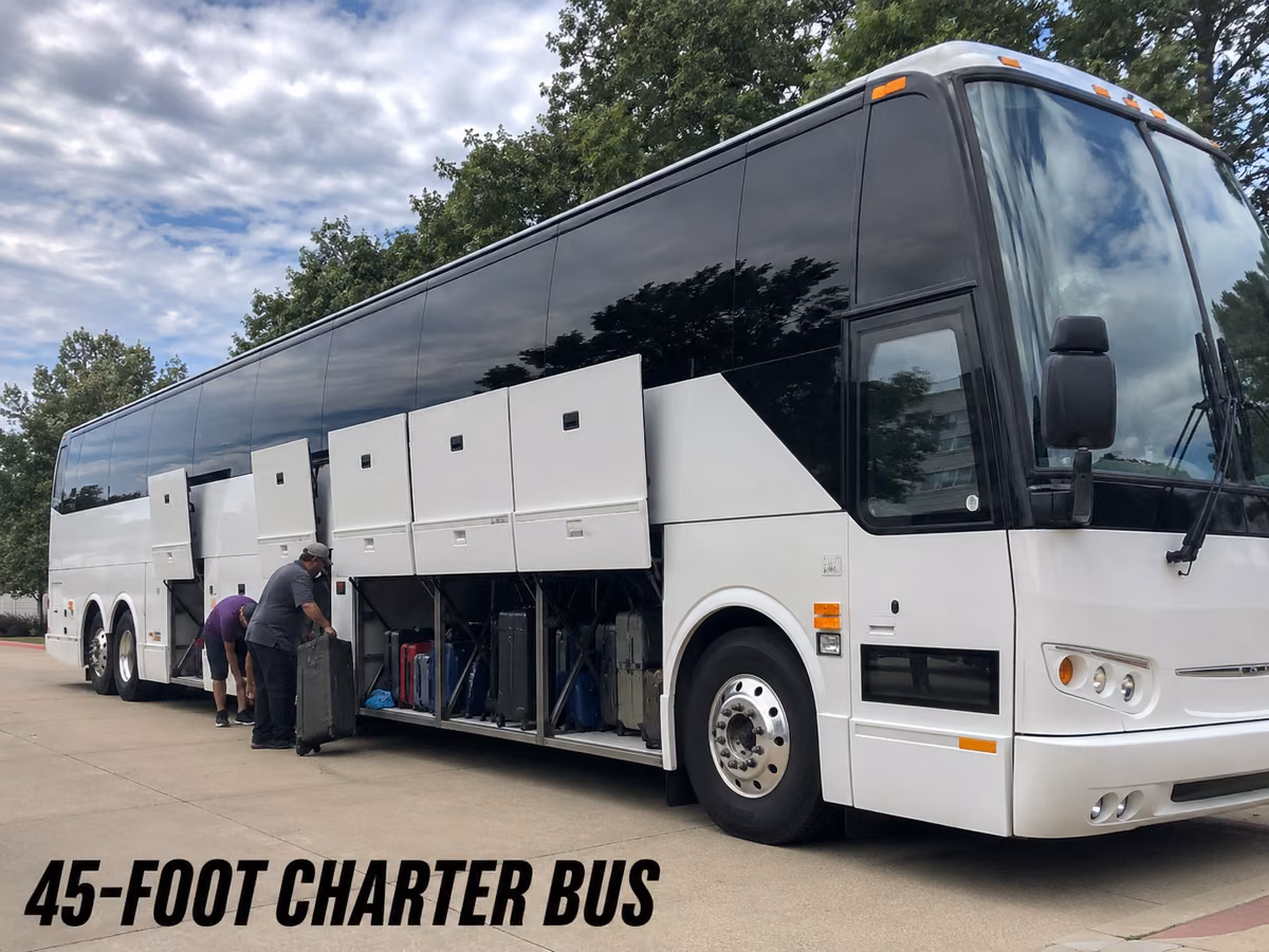A modern white 45-foot charter bus parked at a curb