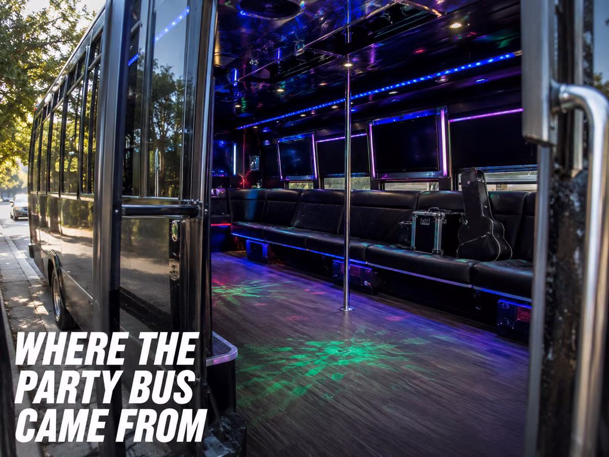 A dark party bus interior lit with blue and purple LEDs and perimeter lounge seating