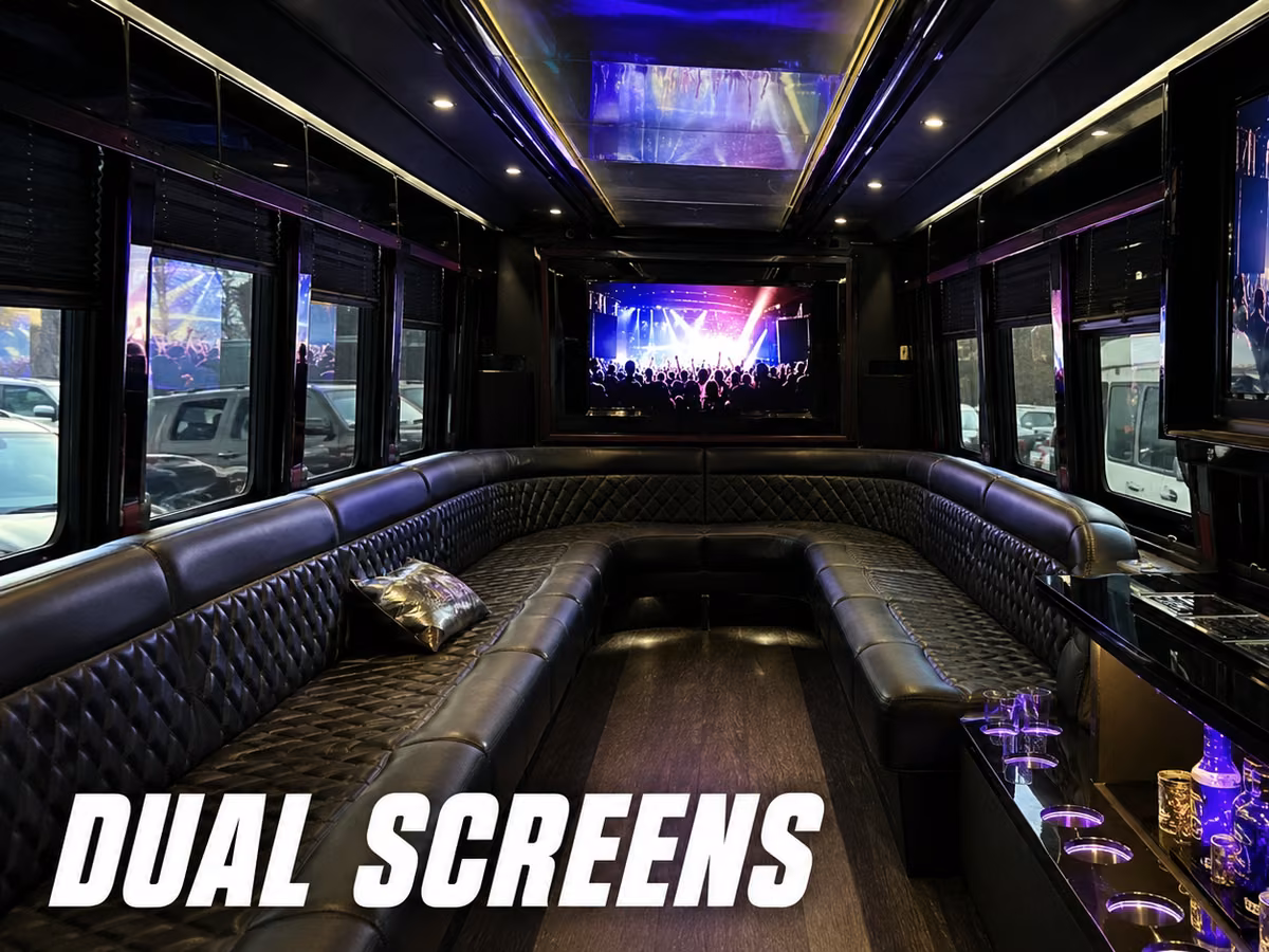 Party bus interior with two large flat-panel screens mounted at opposite ends of the cabin