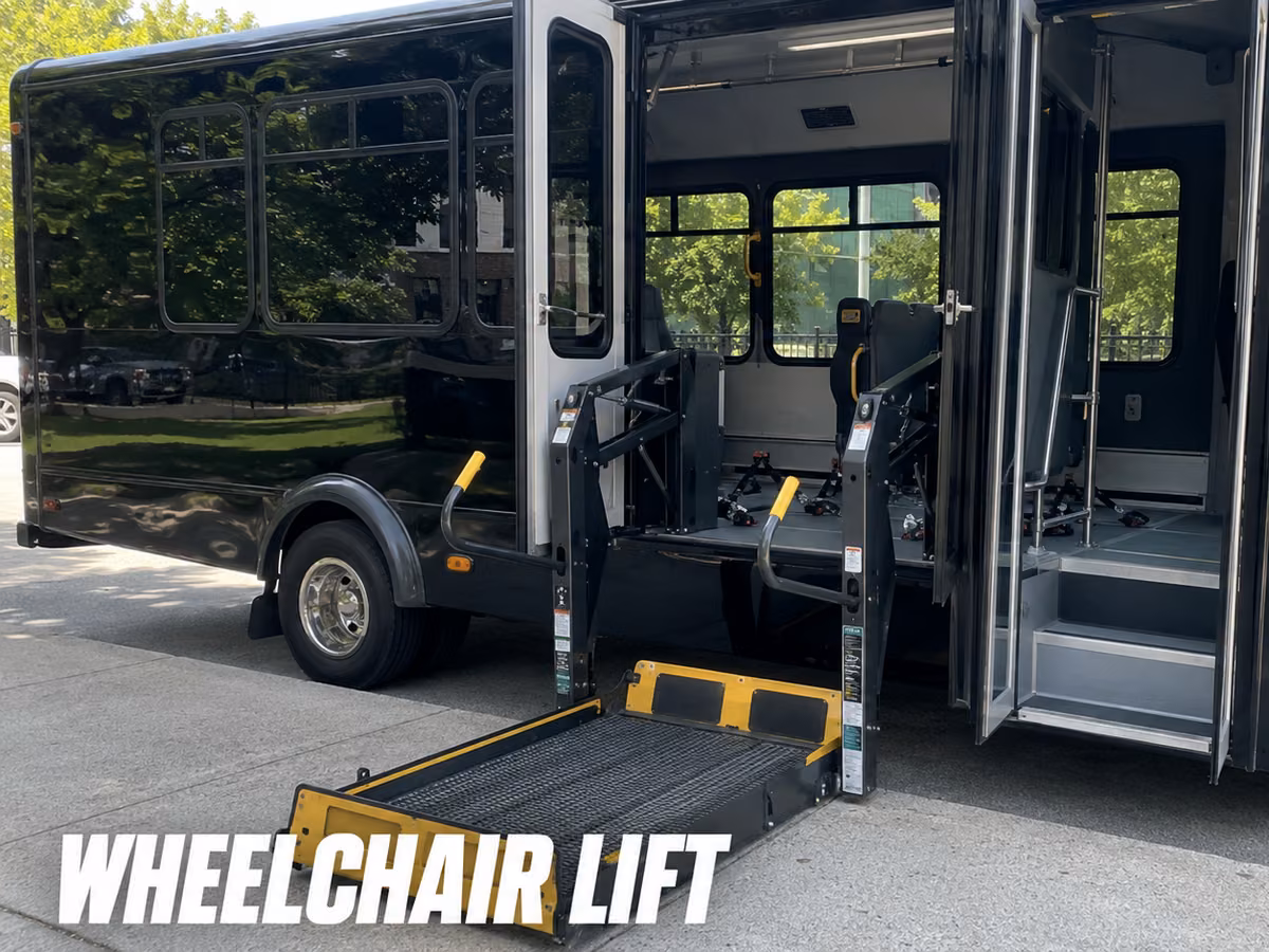 Party bus with a wheelchair lift platform deployed at the open passenger door