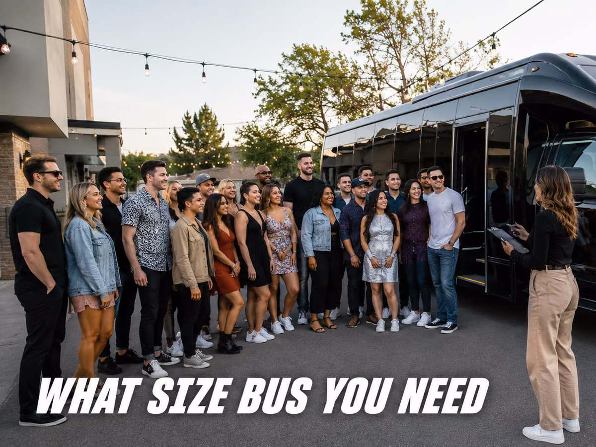 A large group of people standing together in front of a black party bus.