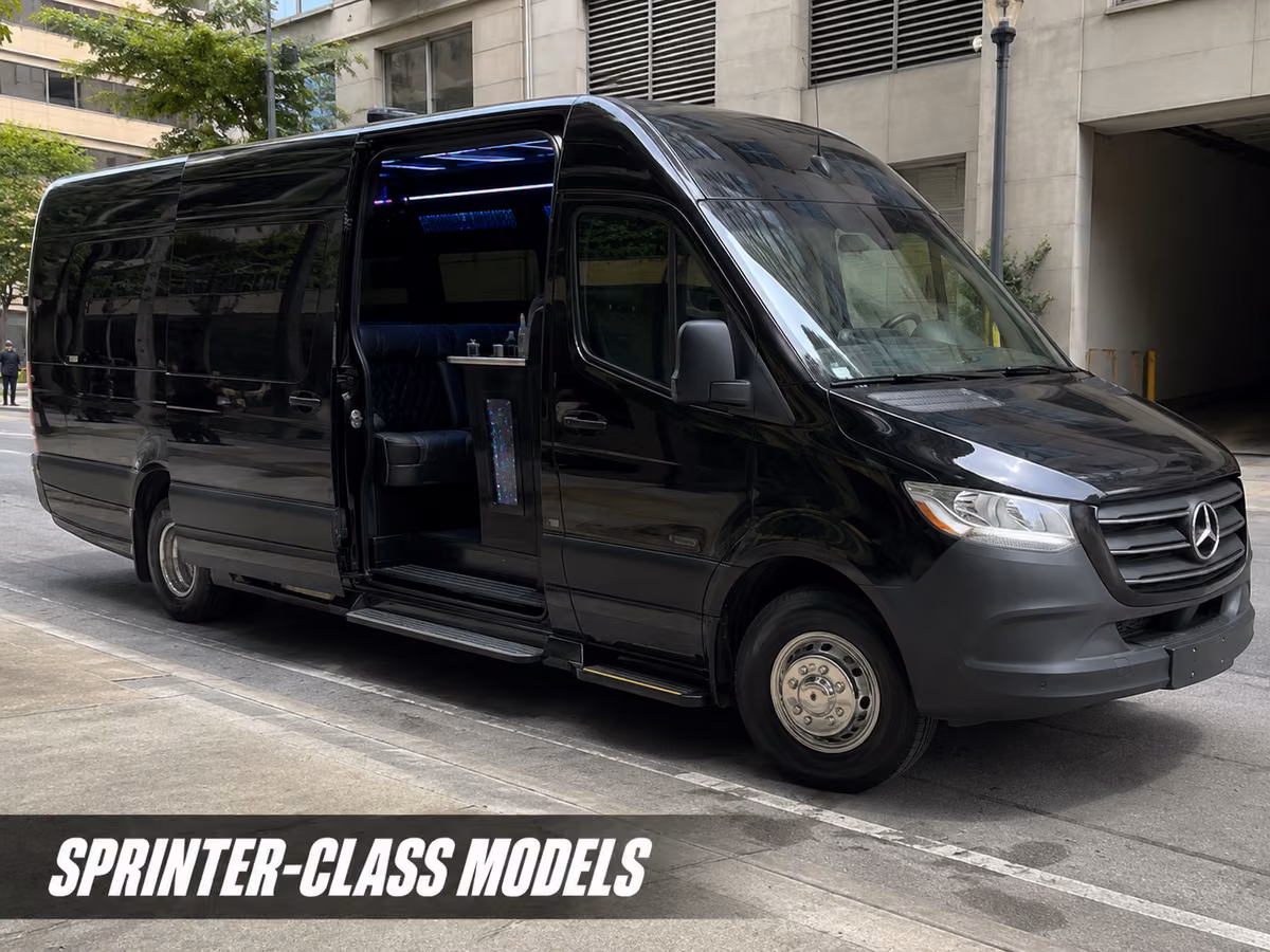 A black Mercedes-Benz Sprinter van parked in front of a concrete parking structure