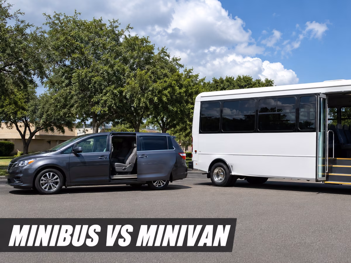 A minivan with its sliding side door open parked beside a white minibus.